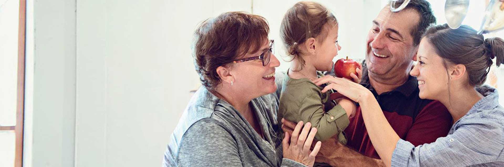 family doting over daughter