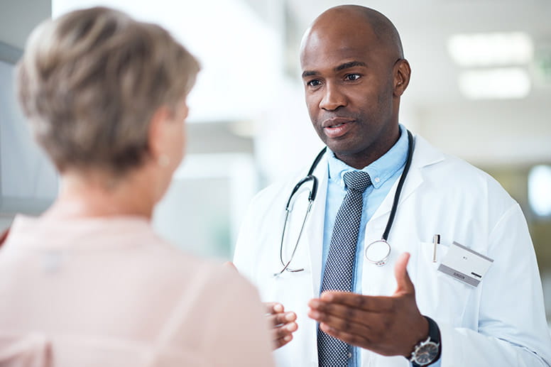 Doctor with patient talking