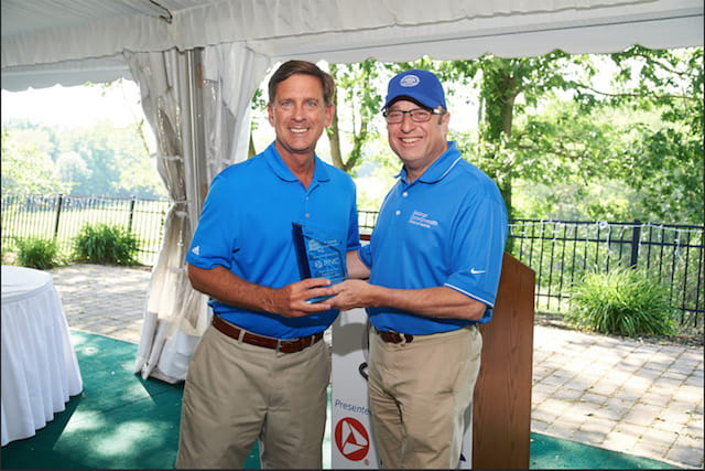 Steven J. Scheinman, MD, president and dean of Geisinger Commonwealth School of Medicine (Geisinger Commonwealth) presents Pete Danchak, regional president, PNC Bank with a token of thanks