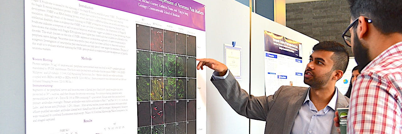 Man pointing at poster