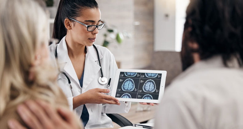 A medical professional displaying an image