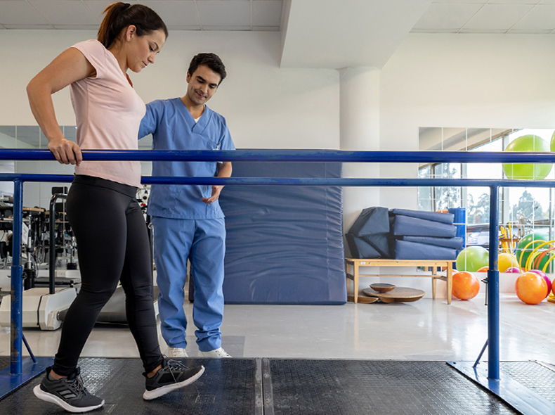 a physical therapist working with a patient on mobility