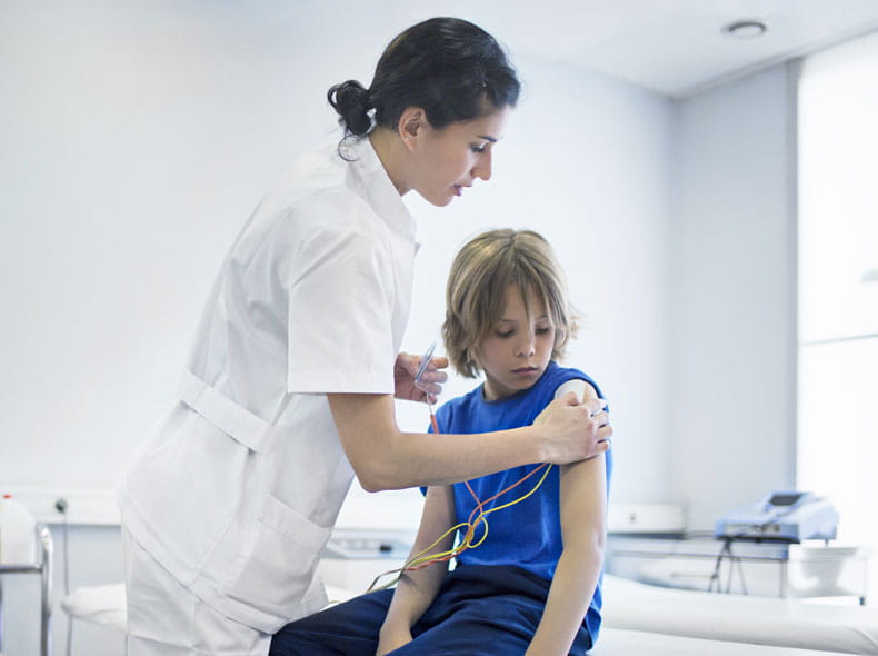 Child being attended to by nurse. 