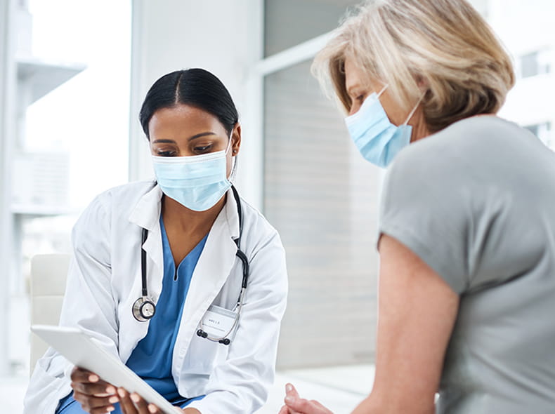 A doctor talking to her patient