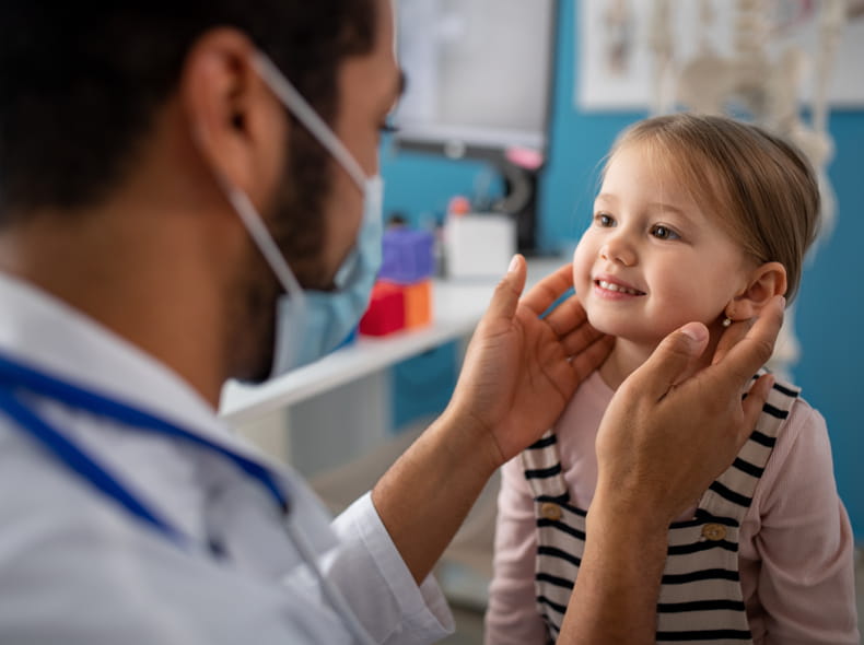 A child receiving an otolaryngology check-up