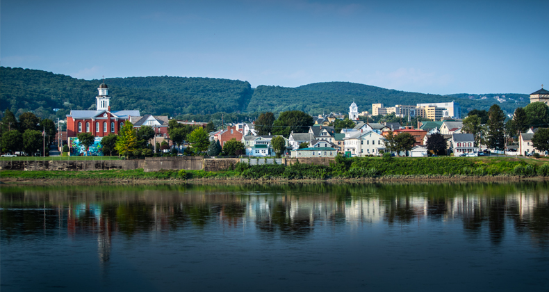 an image of Danville across the late with Geisinger Hospital in the background