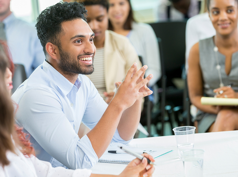 A student smiling in class