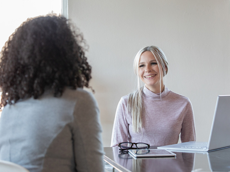 An image of two woman chatting