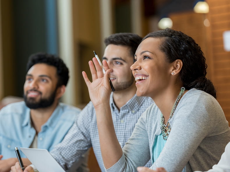 A student raising a hand for a question