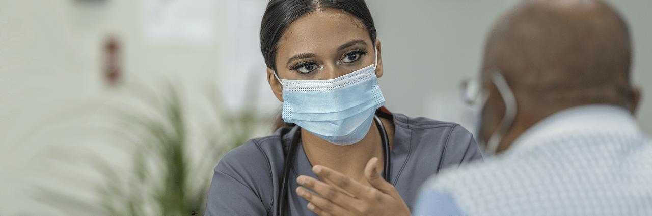 Masked provider with patient