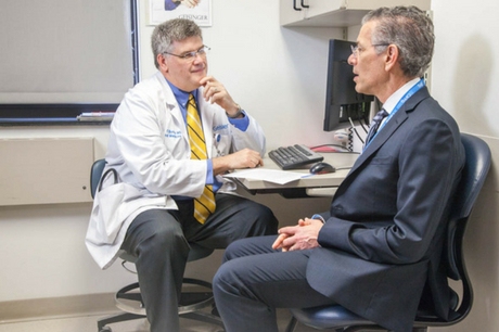 Dr. Gregory Burke discusses medical care with Dr. David Feinberg.