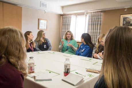 High school students at Geisinger's AIM HI event listen to a presentation.