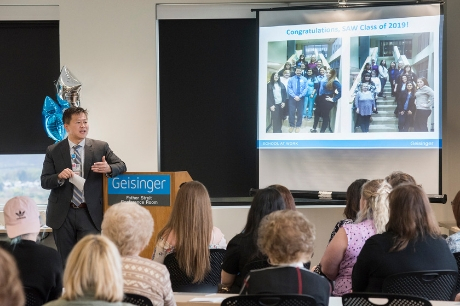 Dr. Jaewon Ryu speaking to the SAW graduates. 
