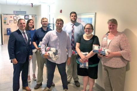 Gloria Balz receives a blanket from Subaru and the Leukemia and Lymphoma Society 