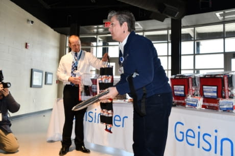 Deb Erdman and John Harahus show off a bleeding control kit