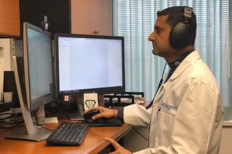 Dr. Prince Mohan conducting a telemedicine visit. 