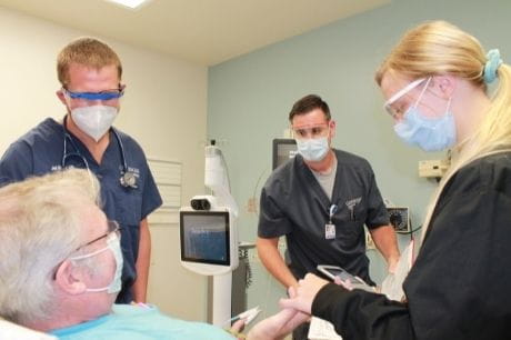 Geisinger emergency department care team members work up a patient.