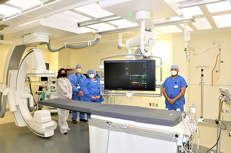 Geisinger Lewistown Hospital recently introduced a hybrid surgical suite, which combines a traditional operating room with precise imaging capabilities that allow image-guided, complex surgical procedures all in one surgical room. Pictured are: Michelle Thoma, director, interventional radiology, Geisinger; Todd Yoder, special procedure radiographer, Geisinger Lewistown Hospital; Hannah Ruby, special procedure radiographer, Geisinger Lewistown Hospital; and Dr. Mark Massak, interventional radiologist, Geisinger Lewistown Hospital.