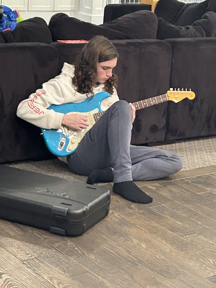 Santino DePalma playing guitar