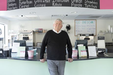 Charles smiling and standing outside Tasty Freeze, where he had his stroke.