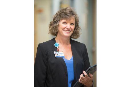 System support specialist associate Teressa Sweet holds a keyboard in one of our Geisinger clinics. 