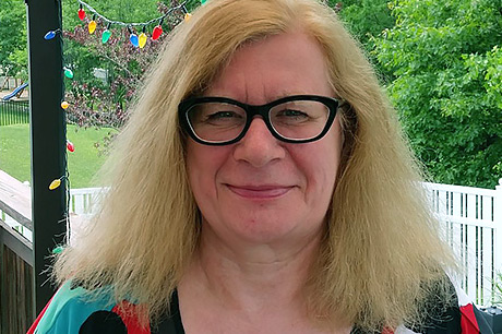 Eva McLaughlin smiles in an outdoor setting, two months after surgery to remove her colon cancer.