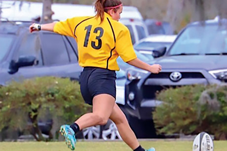 Maddy Ross playing Rugby.
