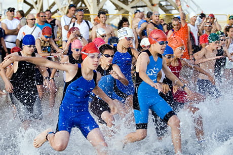 Group running into water
