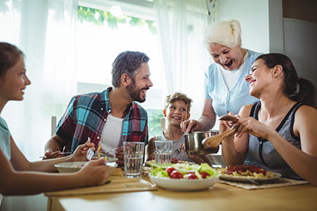 Family sitting together at the dinner table 
