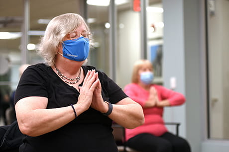 Bette Wood attending a chair yoga class at Geisinger 65 Forward in Scranton.