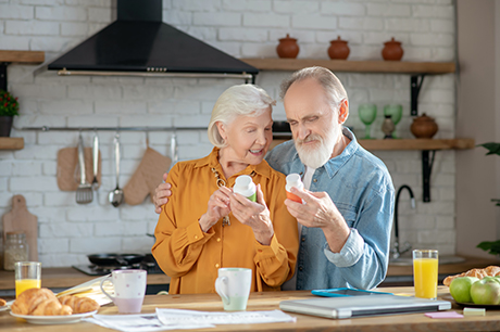 an older couple in their kitchen