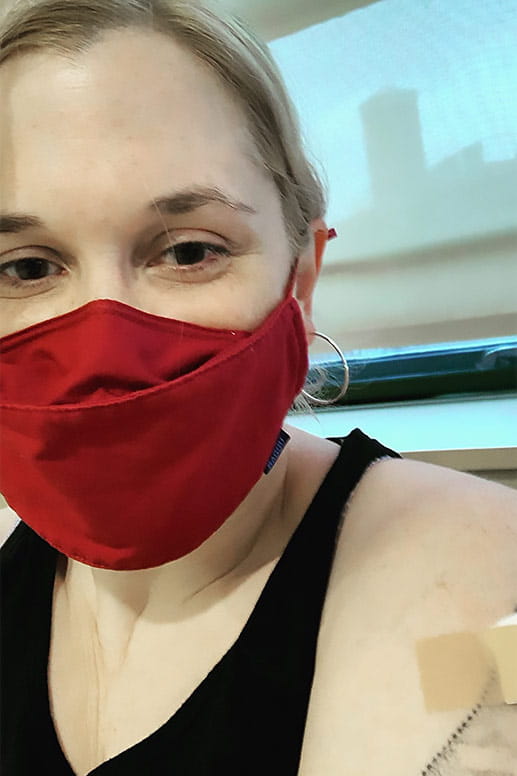 Heather receives her first COVID vaccination shot.