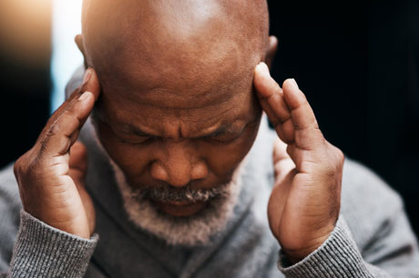 Adult male suffering potential stroke symptoms.