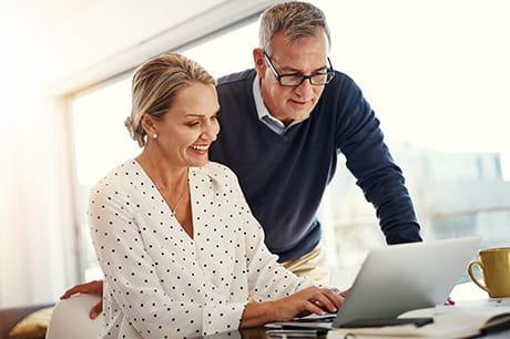 Couple browsing internet for Medicare information