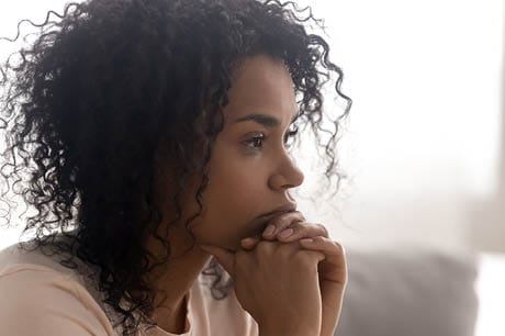 A woman with a stressful look