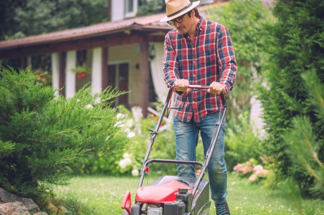 A man mowing his lawn