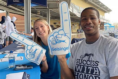 Basketball players Makenna Marisa and Jameel Brown at a Blue-White Weekend event.