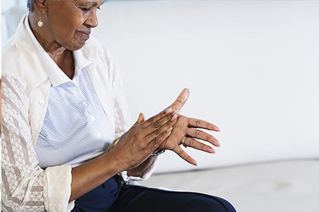 A woman suffers from neuropathy as a result of chemotherpay.