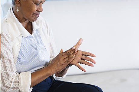 A woman suffers from neuropathy as a result of chemotherpay.