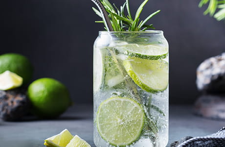 Glass of sparking water with lime. 