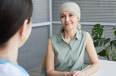 Woman talking with doctor. 