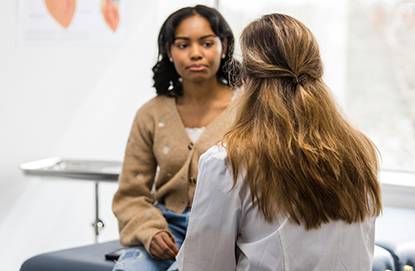 A young woman consulting her doctor.
