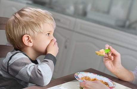 Toddler boy refusing to eat food from mom