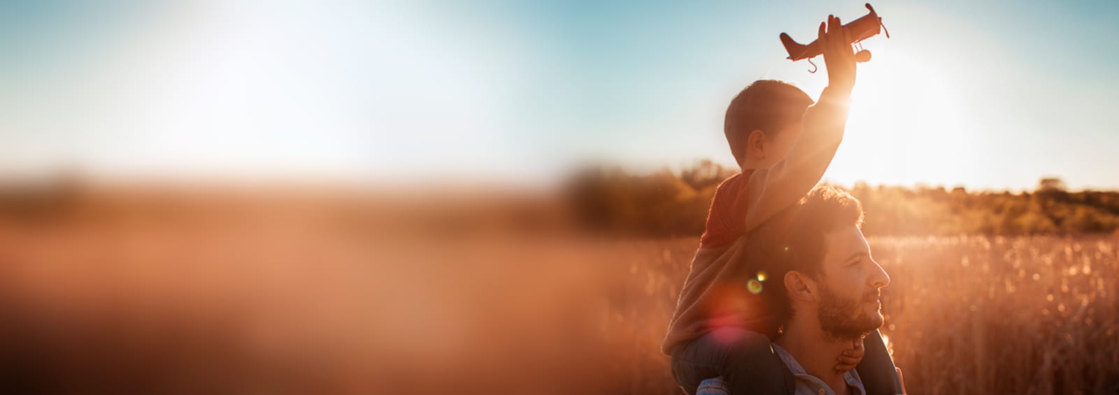 father and son in sunset