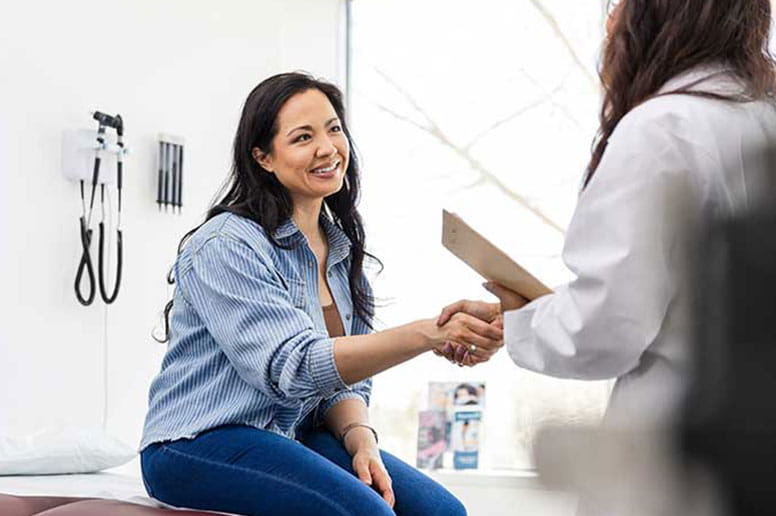Man with glasses wearing a mask promoting to get care now if needed