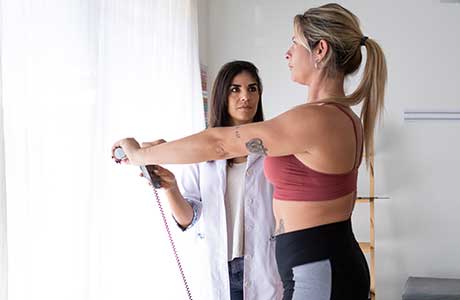 A doctor with a patient working on physical thearpy