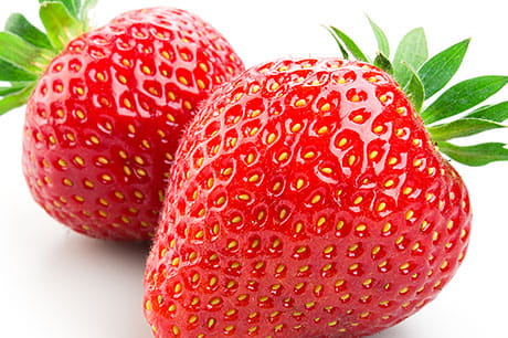 A closeup photograph of strawberries.