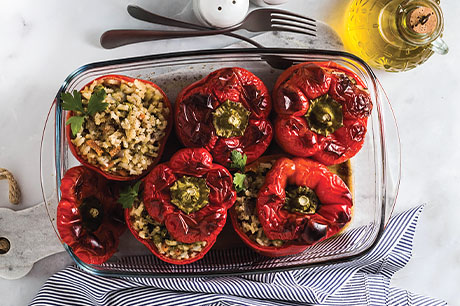 A prepared dish of vegetarian stuffed peppers.